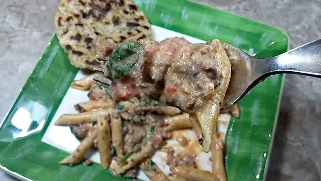 low sodium penne and beef on fork