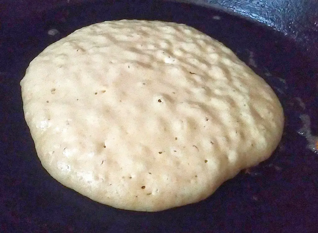 Buttermilk pancake bubbling ready to flip