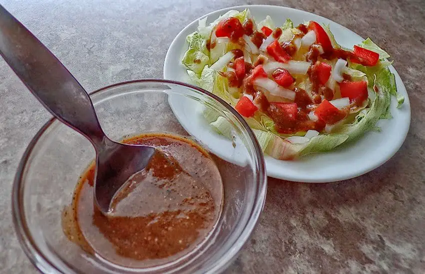 Italian dressing -spooned on salad