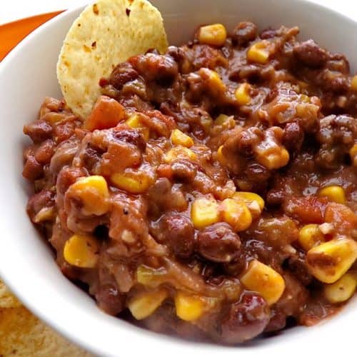 Black bean and salsa dip with tortilla chip