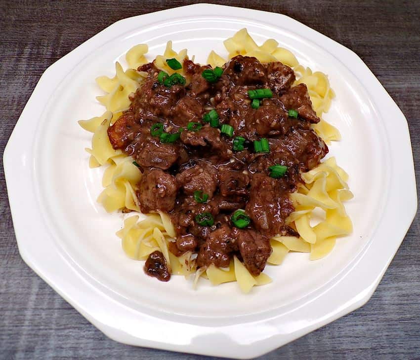 Low sodium mushroom sauce and beef on white plate