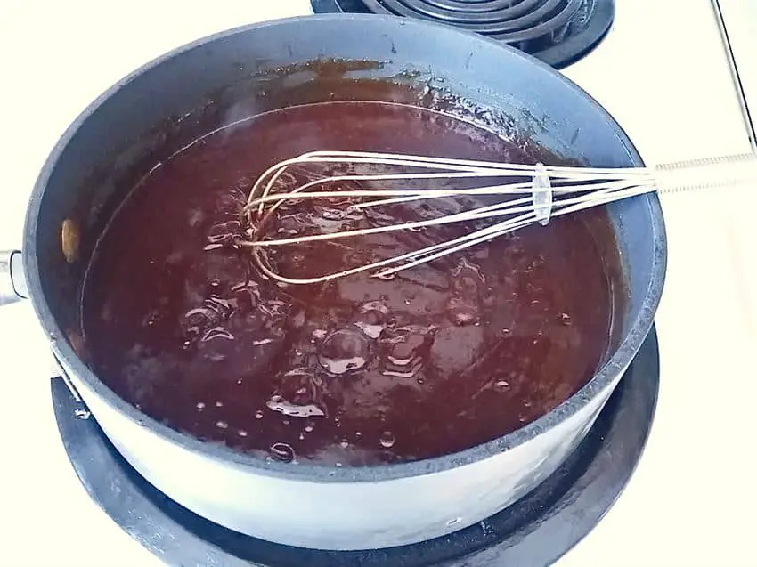 Simmering barbecue sauce in pan