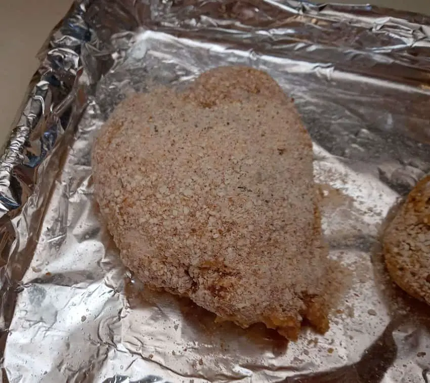 Bread cover chicken thigh ready for oven