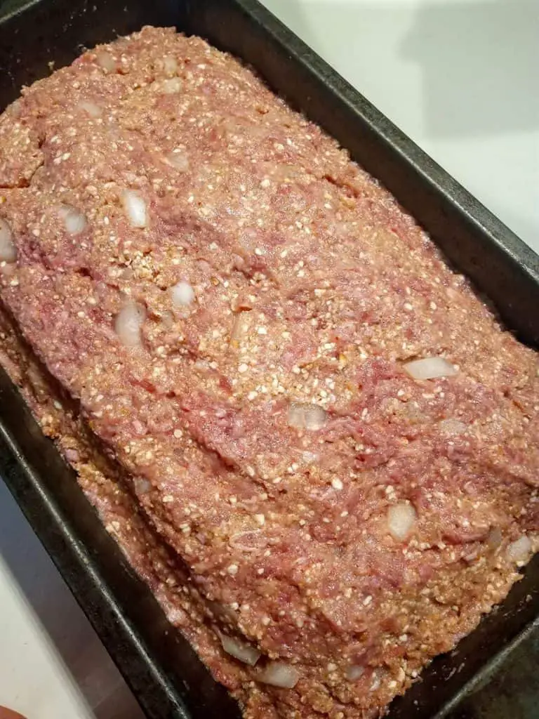 Mixed meatloaf in pan ready for oven