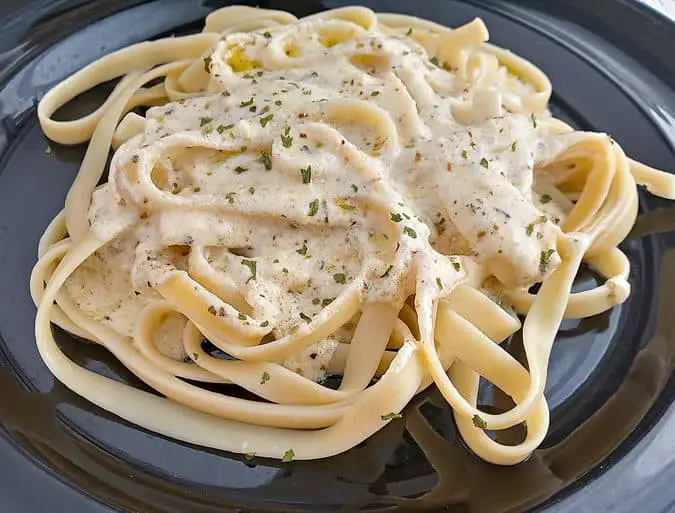 Alfredo sauce on fettuccini