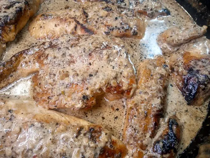 Creamy garlic chicken in skillet closeup