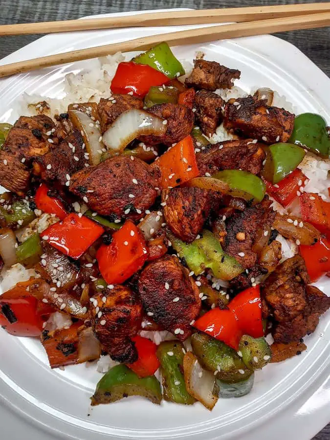 Pepper chicken stir fry with chopsticks