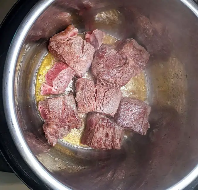Meat browning in pot
