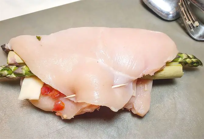 Stuffed breast pinned together