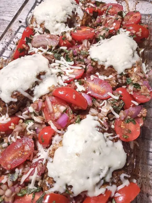 Baking dish of low sodium chicken bruschetta hot from oven