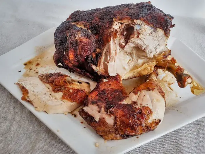 Rotisserie chicken with leg and sliced breast meat