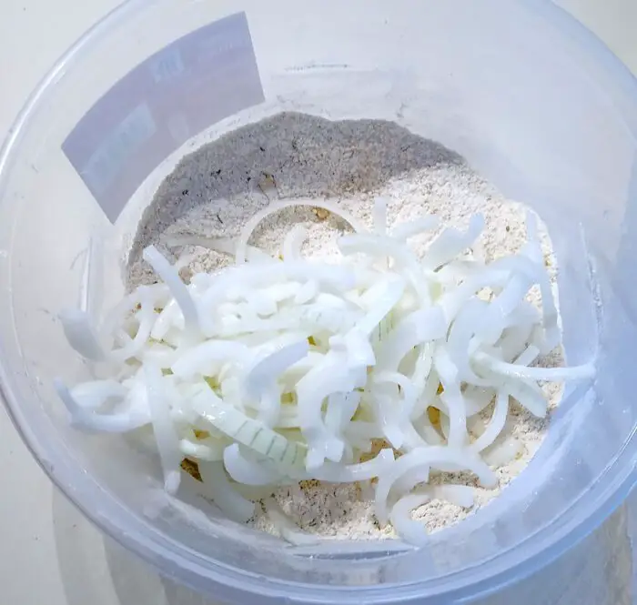 Shake coating onto onions with covered bowl