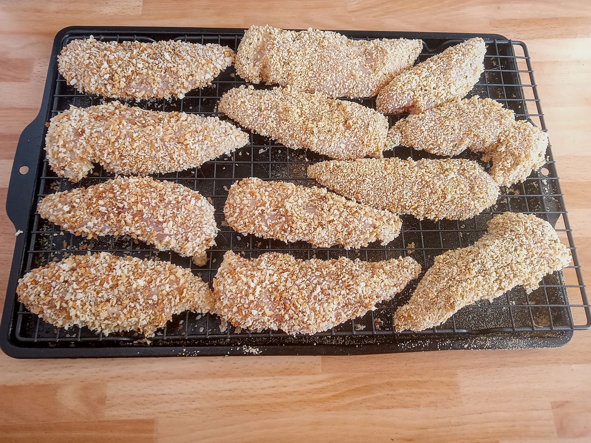 Chicken tenders on baking rack ready for oven