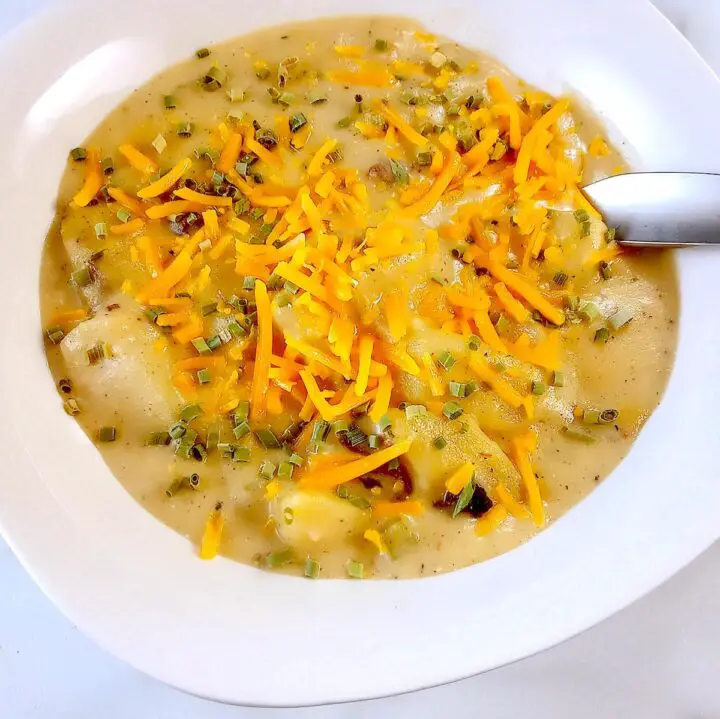 Low sodium potato soup with shredded cheese and chives