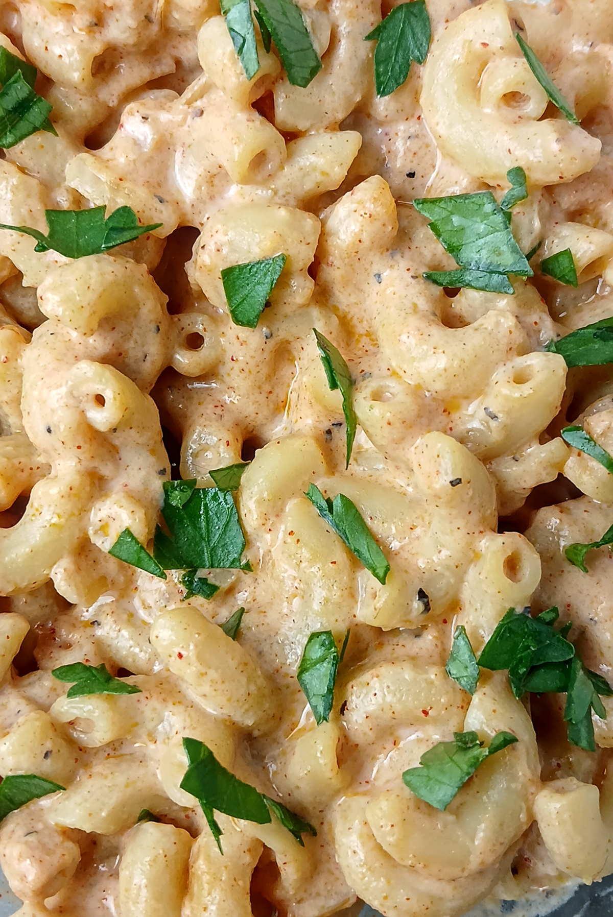 Extreme closeup of creamy, cheesy low sodium mac and cheese.