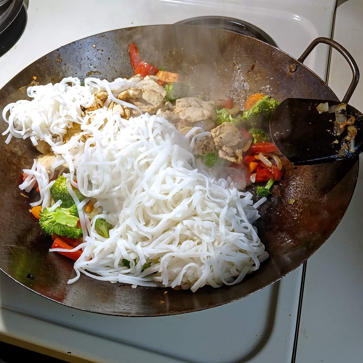 Low sodium chicken stir fry combined-ingredients in wok.