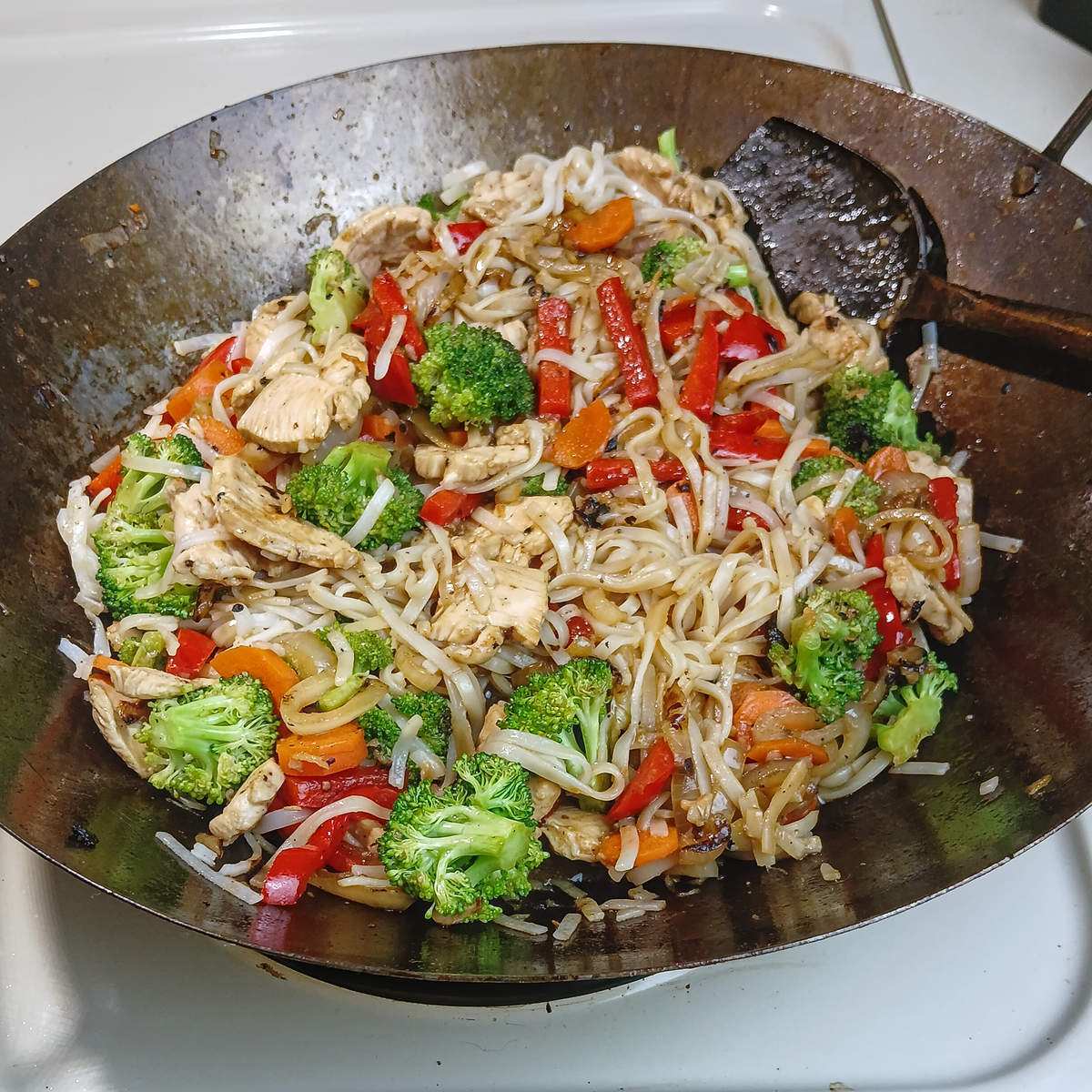 Low sodium chicken stir fry final cook in wok.