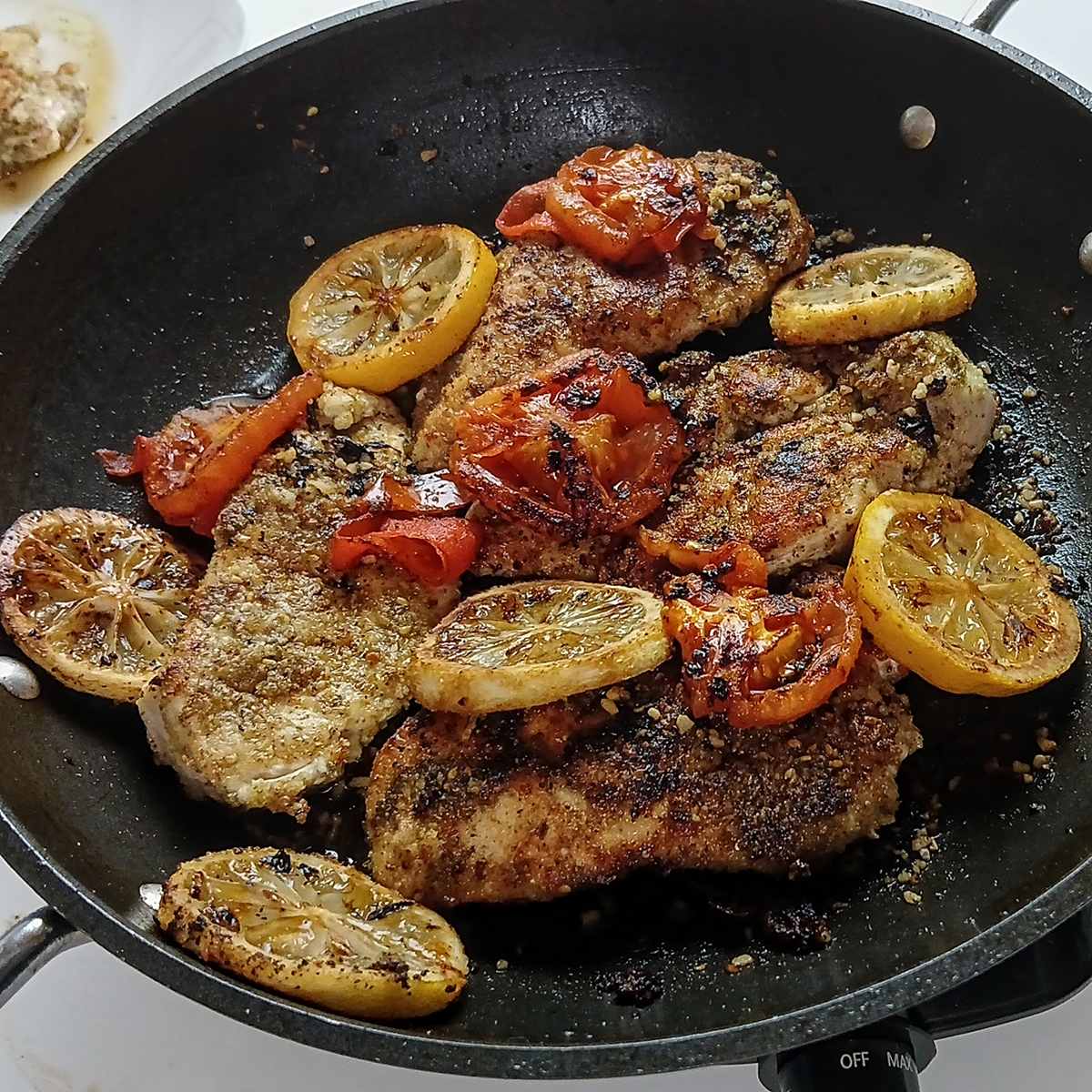 Low Sodium Lemon pepper chicken in skillet.