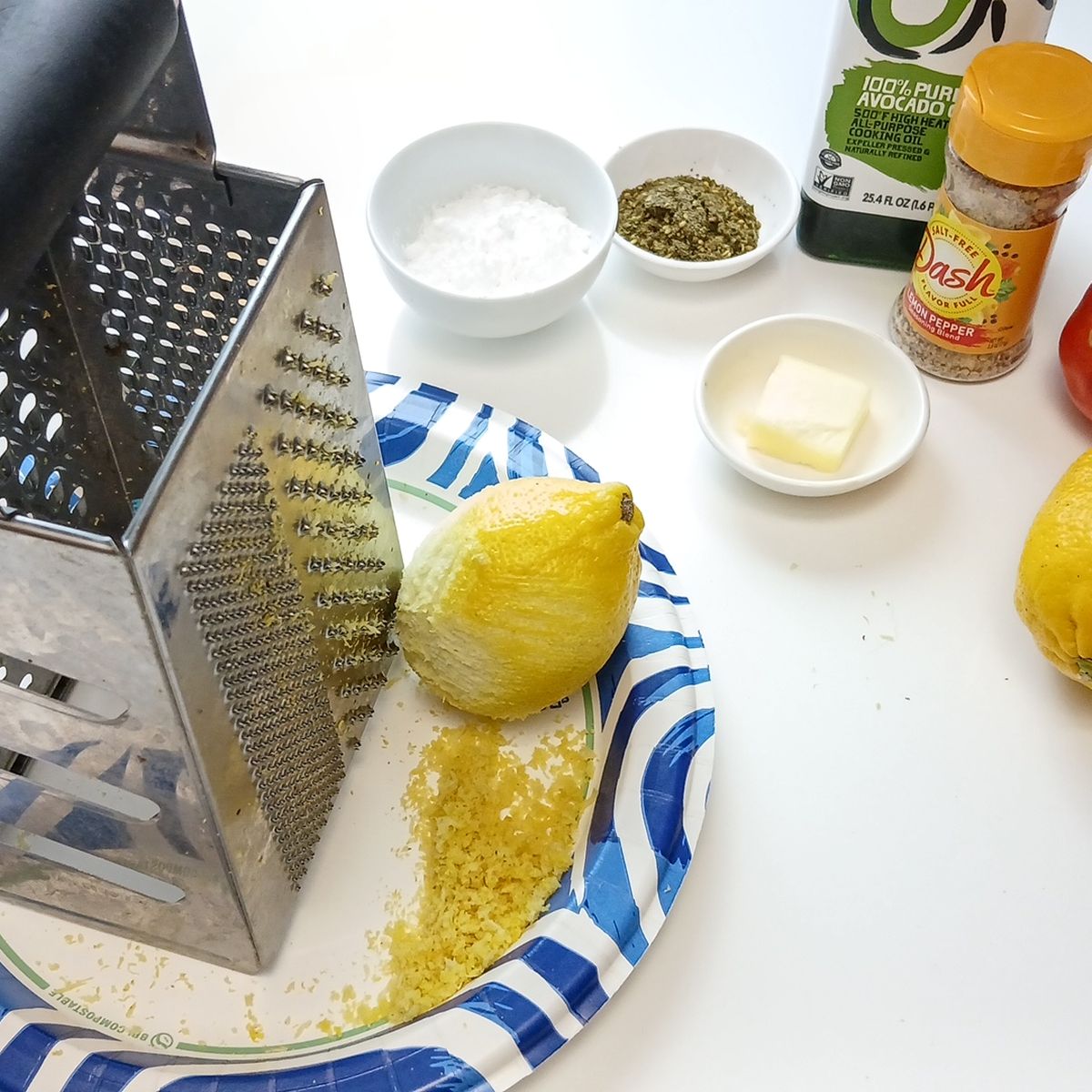 Low Sodium Lemon pepper chicken zesting the lemon