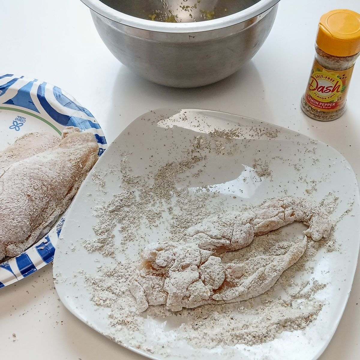 Low Sodium Lemon pepper chicken, zesting and flouring chicken