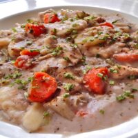 Low angle view of Low sodium Chicken and dumplings in a white bowl