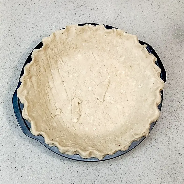 low sodium pumpkin pie dough in pan ready to parbake