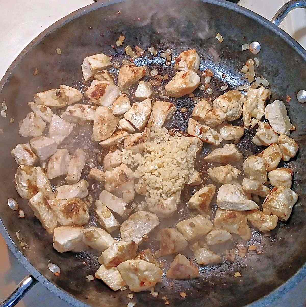 Add garlic to the brown chicken at the last two minutes - process shot 3