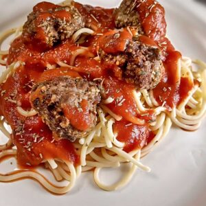 Low sodium Italian meatballs closeup with noodles and-sauce featured image.