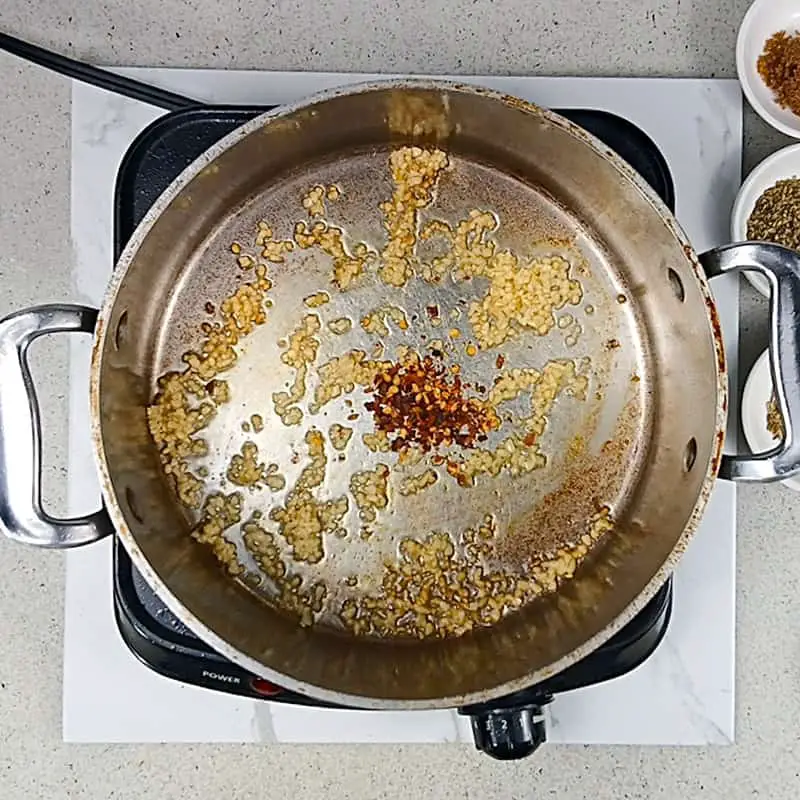 Process-shot-1 Sauteing garlic and red pepper flakes.